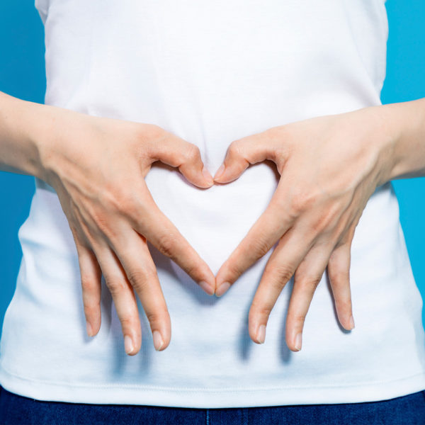 C plus - woman holding her hands in a heart shape